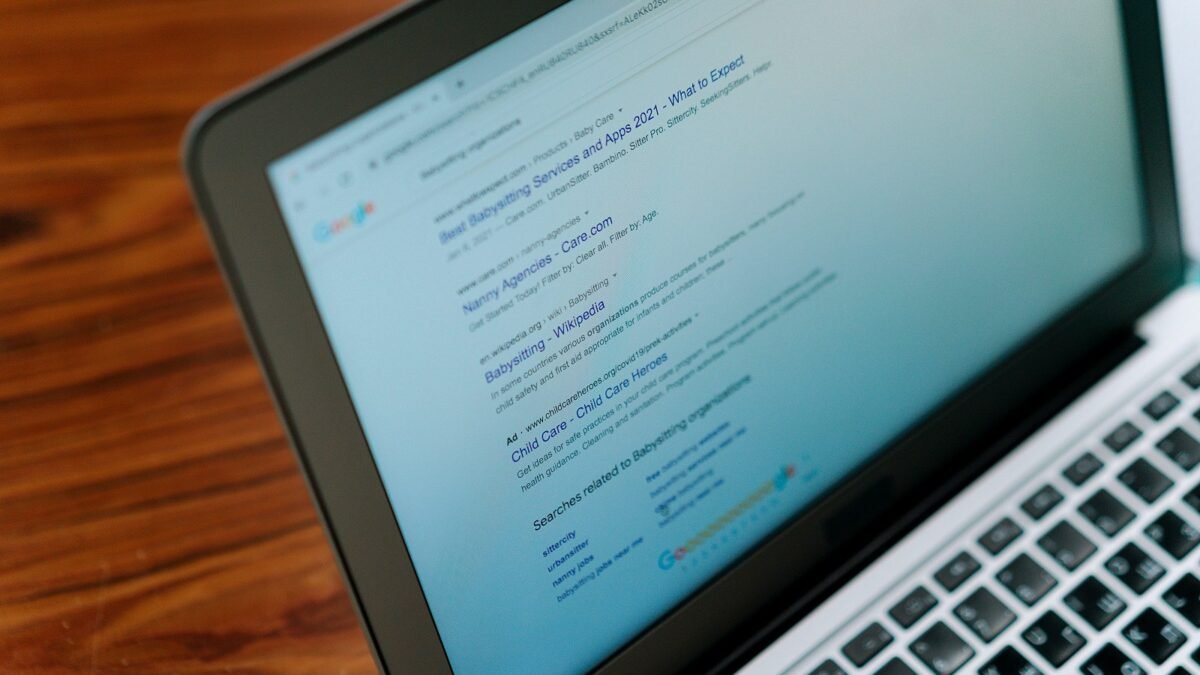 A laptop screen showing a page of search results, seen from close up.