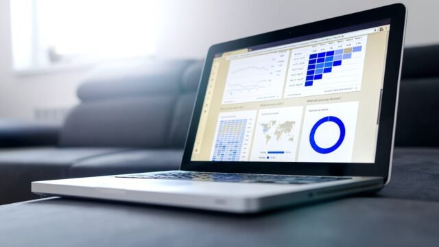 Sleek laptop showcasing data analytics and graphs on the screen in a bright room.