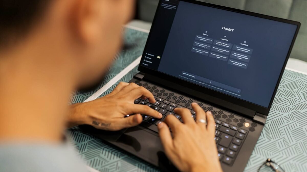 A person at a laptop reads product suggestions in a chat window, with a coffee mug beside the keyboard.