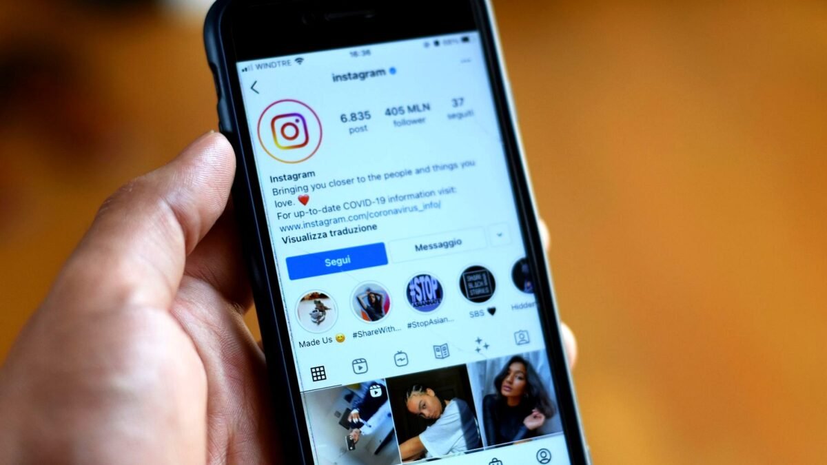 Close-up of a smartphone displaying an Instagram profile screen.
