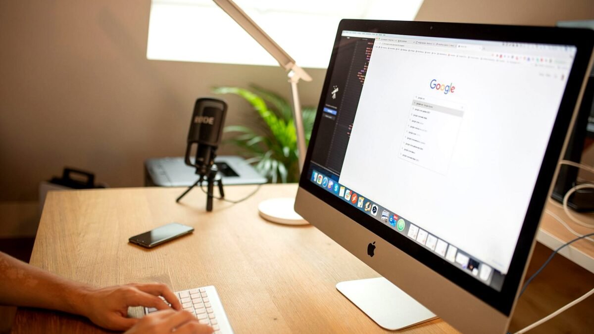 Desktop computer screen showing a Google search results page on a desk