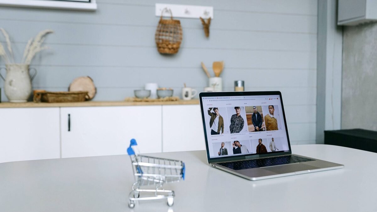 A laptop screen showing an online shop with product listings