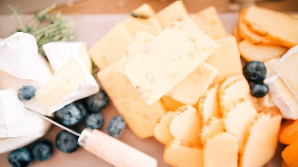 Close-up of soft cheese slices arranged on a light surface
