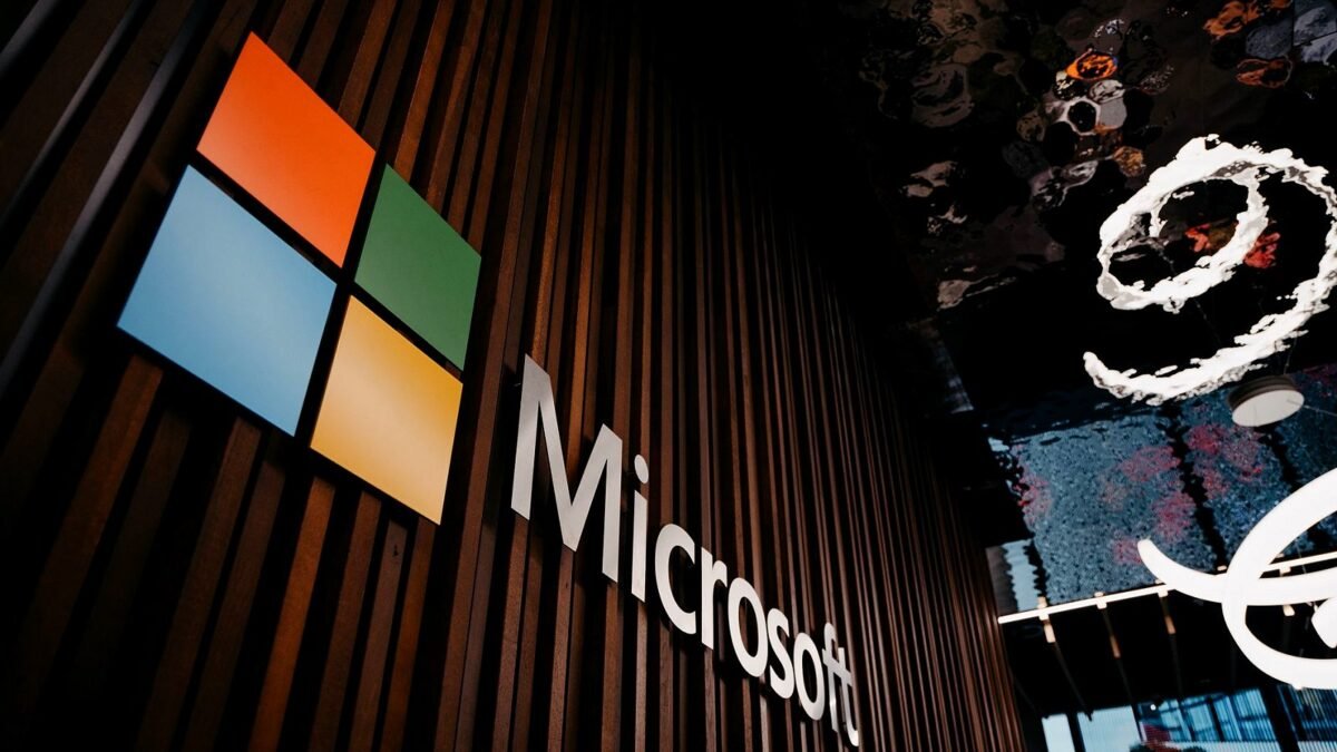 Microsoft logo on a wooden wall inside the company's office