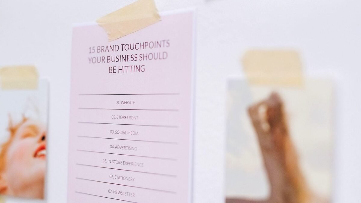 A wall covered with handwritten notes listing brand touchpoints in an agency office