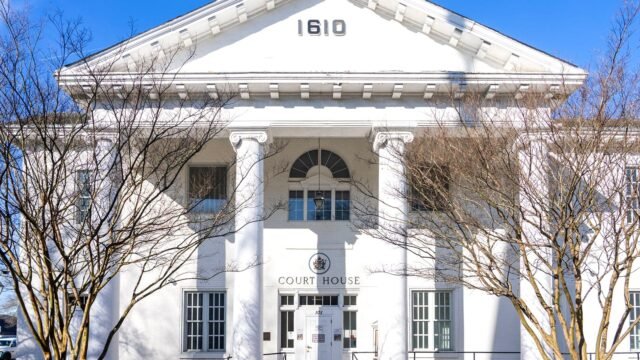 Front view of the historic Hampton Courthouse in Virginia, showcasing Neoclassical architecture.