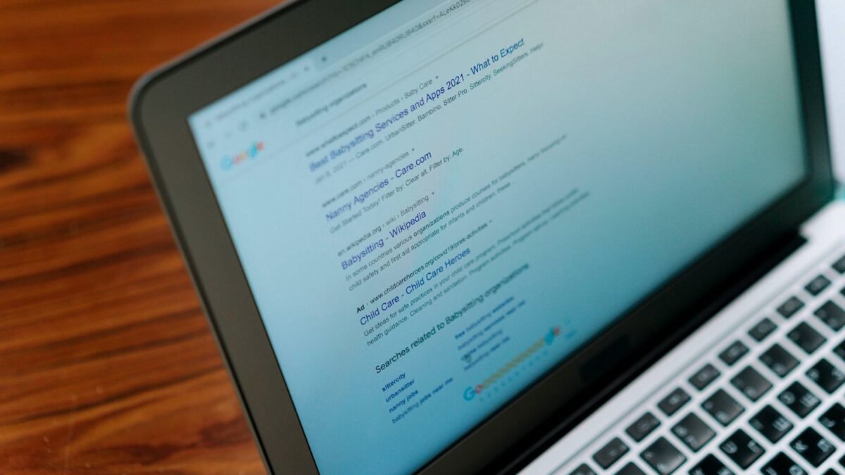 A close-up of a laptop screen showing a search engine results page.
