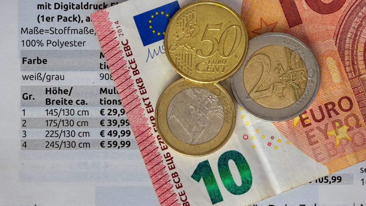 Euro banknotes and coins lying on a table