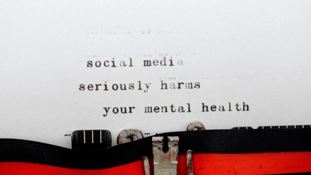 Vintage typewriter conveying message on social media's impact on mental health.
