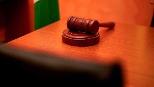 Close-up of a gavel on a courtroom desk