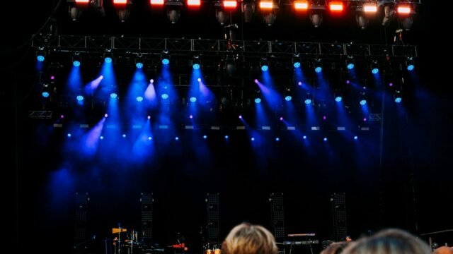 Concert stage with audience and coloured lighting