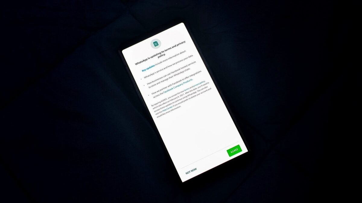 A phone screen showing a long policy document that a user has to accept