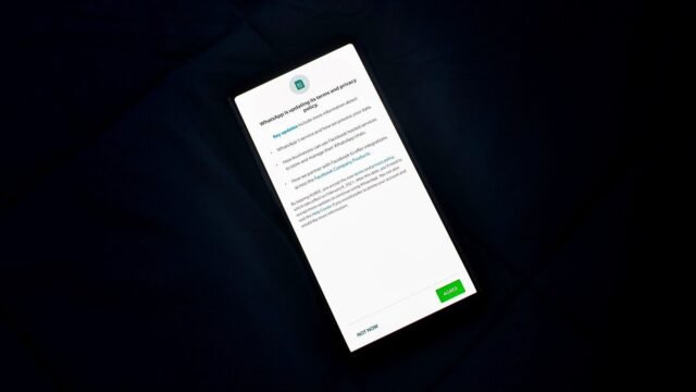 A phone screen showing a long policy document that a user has to accept