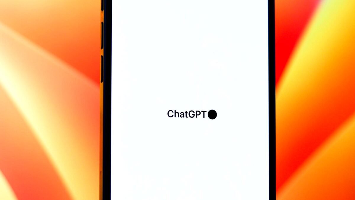 Smartphone screen showing the ChatGPT app against a colourful background