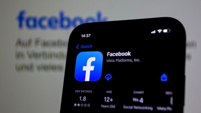 Smartphone screen with the Facebook app open, held close up