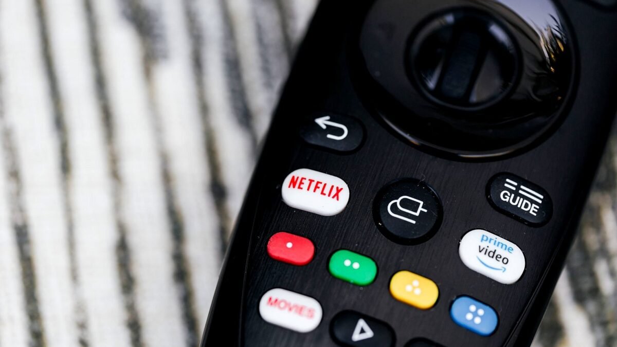 Close-up of a TV remote with buttons for streaming services