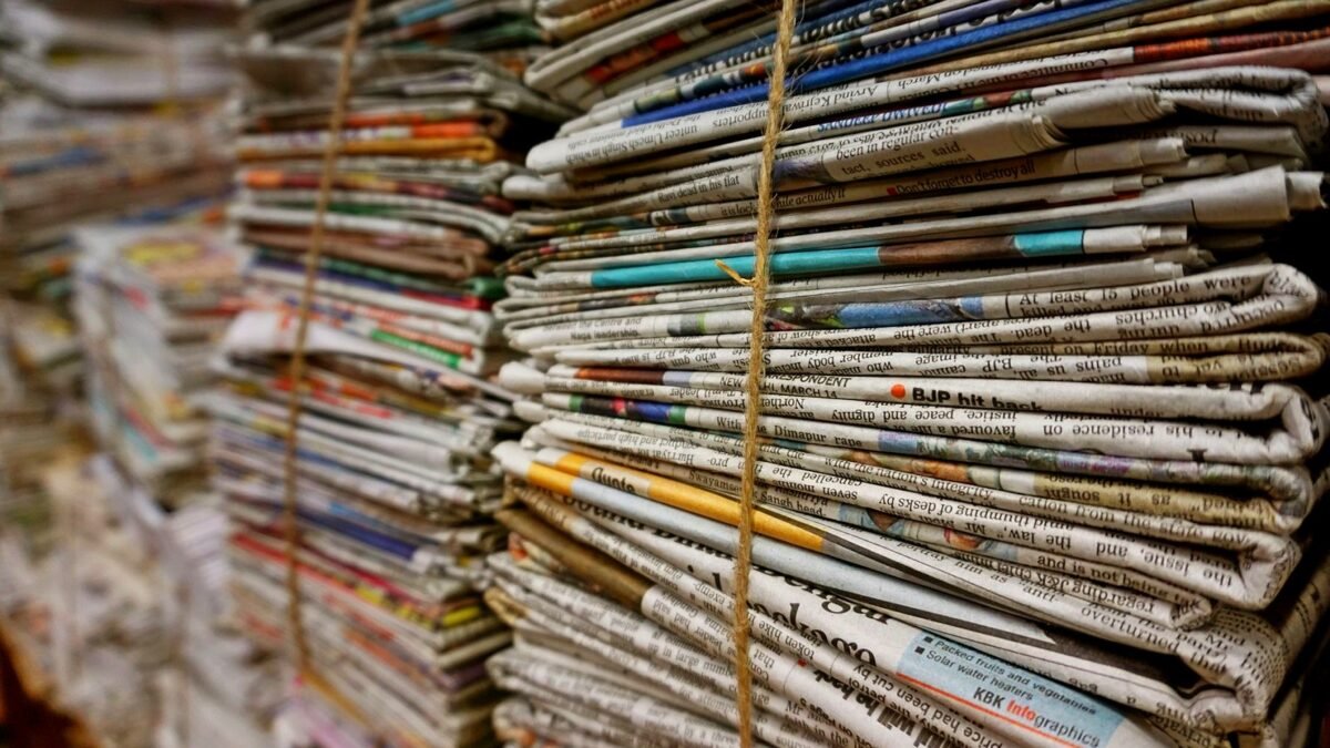 Bundles of newspapers tied with twine