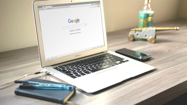 Laptop on a tidy desk with the Google search page open on the screen