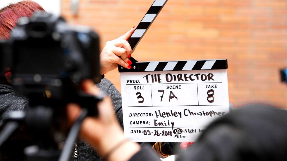Clapperboard held in front of a film camera during a take
