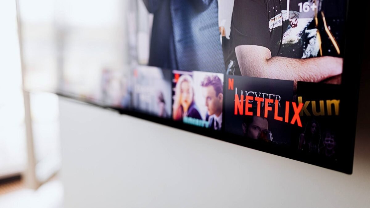 Smart TV in a living room showing the Netflix home screen