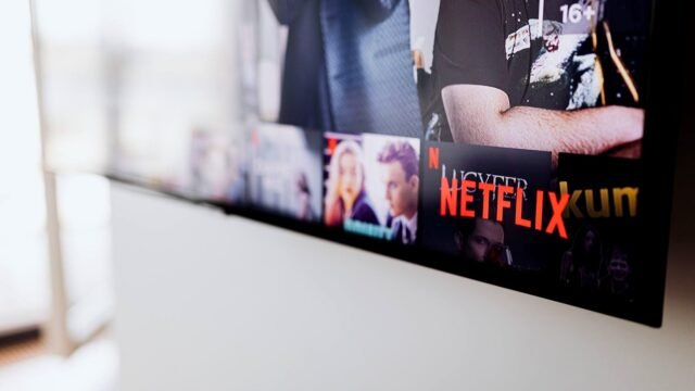 Smart TV in a living room showing the Netflix home screen
